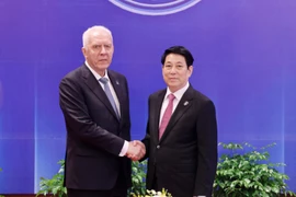 State President Luong Cuong (R) receives Russian Prosecutor General Alexander Gutsan in Hanoi on October 25. (Photo: VNA)