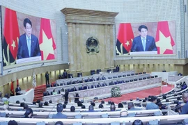 President Luong Cuong delivers a keynote policy address at the plenary session of the Angolan National Assembly on August 7. (Photo: VNA)