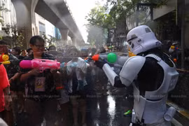 Thai and foreign tourists join the Songkran festival on Silom Road in Bangkok last year. (Photo: Bangkok Post)