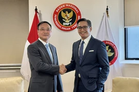 Lieutenant General Pham The Tung, Deputy Minister of Public Security of Vietnam (L) and Deputy Director of Indonesia's National Counterterrorism Agency (BNPT) Andhika Chrisnayudhanto (Photo: VNA)
