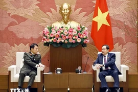 National Assembly Chairman Tran Thanh Man (R) and Minister of Public Security General Luong Tam Quang at a meeting on February 4 (Photo: VNA)