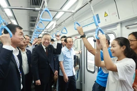 Party General Secretary To Lam rides the Ben Thanh-Suoi Tien metro line (metro line No.1) on February 22. (Photo: VNA)