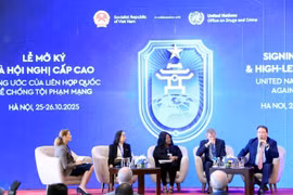 Delegates at the roundtable on protecting women and children in cyberspace on October 26 (Photo: VNA)