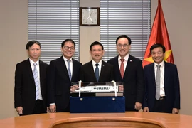 Deputy Prime Minister Ho Duc Phoc (centre) says that the high-speed rail system must be developed harmoniously, from design and track production to signaling, rolling stock, operations, and maintenance. (Photo: VNA)