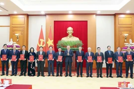 Party General Secretary To Lam presents decisions on the authority, functions, tasks, organisational structures, and working relations of the 13 agencies. (Photo: VNA)