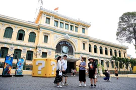 HCM City Post Office is a renowned tourist attraction, drawing crowds of visitors. (Photo: VNA)