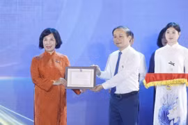 The Vietnam News Agency wins Prize A for its standout exhibition booth. (Photo: VNA)