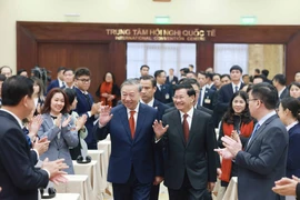 Top Vietnamese, Lao leaders hold talks in Hanoi