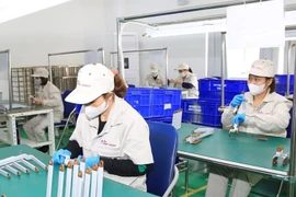 The Government's new policies create new development opportunities for the supporting industries. (Photo: Hanoimoi.vn)