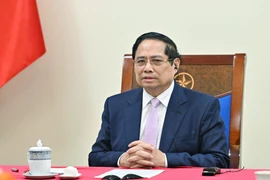 Vietnamese Prime Minister Pham Minh Chinh holds phone talks with his Malaysian counterpart Anwar Ibrahim on July 30. (Photo: VNA)