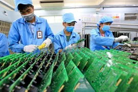 Electronic components are manufactured at the Central Power Electronic Measurement Equipment Manufacturing Center in Da Nang city. (Photo: VNA) 