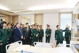 Party General Secretary To Lam and several key political figures visit the the Institute for Health Protection of Central Officials and the Clinical Institute for Infectious Diseases. (Photo: VNA)