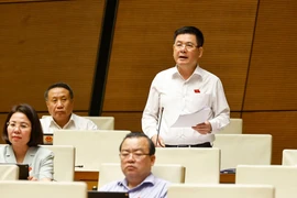 Minister of Industry and Trade Nguyen Hong Dien at the 15th National Assembly’s 9th session on June 17 (Photo: VNA)