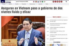 Prensa Latina's article on Vietnam’s assurance of smooth and effective transition to a leaner structure. (Photo: VNA)