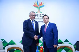 PM meets leaders of WHO, AIIB in Brazil