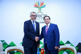 PM meets leaders of WHO, AIIB in Brazil