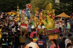 People and performers accompany a float during a Songkran procession through downtown Phra Pradaeng district in Samut Prakan on 21 April 2024. The district typically celebrates Songkran festival a week later than the rest of the country. (Photo: Bangkoko Post) 
