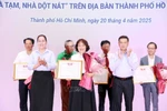 Certificate of merit presented to VIB for supporting housing programme for disadvantaged households in HCM City (Photo: VNA) 