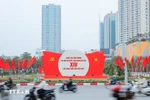 Posters and flags welcoming the 14th National Party Congress. (Photo: VNA) 