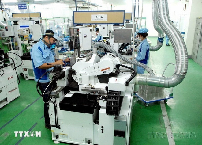 An electronic component production line of the Japanese-invested INOAC Vietnam Co. Ltd in the Quang Minh Industrial Park of Hanoi (Photo: VNA) M&A market waiting for big deals.jpg