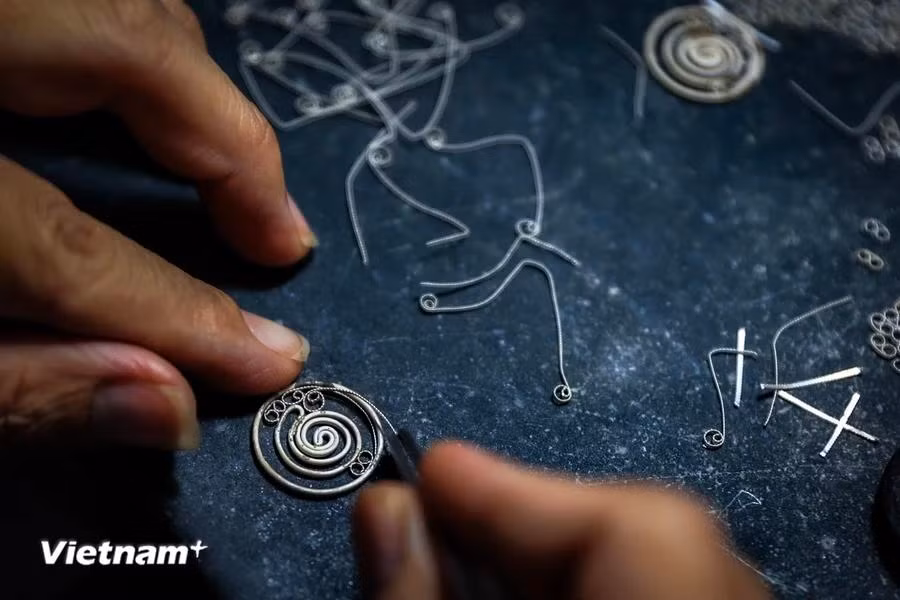 Silversmithing symbolises the diligence of traditional crafts. (Photo: VietnamPlus)