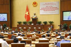 Full-time legislators discuss draft bills, resolution to be approved at NA fourth session