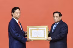 Former Prime Minister presented with 55-year Party membership badge