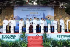 Delegates launch the food festival, product exhibition, and distribution event in Laos’s Khammouane province. (Photo: VNA)