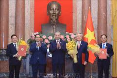 General Secretary of the Communist Party of Vietnam (CPV) Central Committee and State President To Lam (central) presents appointment decisions to three new Deputy Prime Ministers. (Photo: VNA)
