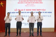 At the signing ceremony (Photo: VNA)