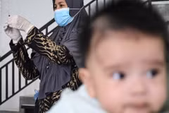 A nurse prepares a Bacillus Calmette-Guerin (BCG) vaccine for tuberculosis during a national immunisation for children programme at an integrated services post in Banda Aceh, Aceh on June 9, 2022. (Photo: AFP)