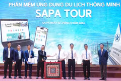 Representatives from agencies are at the launching ceremony of the app "Sapa Tour" to promote tourism in resort town of Sa Pa in northern province of Lao Cai. (Photo: nhandan.vn)