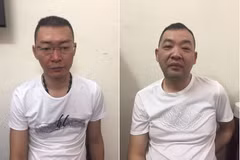 Vietnam hands over two wanted men to China