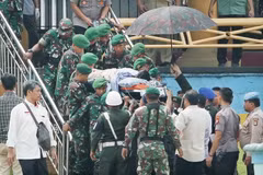 Three Indonesian officers demoted after wives post comments on security minister attack
