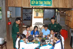 Border guard soldiers help teach students 