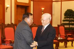 Party leader, President receives Lao counterpart