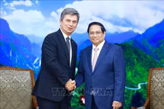 PM Pham Minh Chinh (R) and FIATA President Turgut Erkeskin (Photo: VNA)