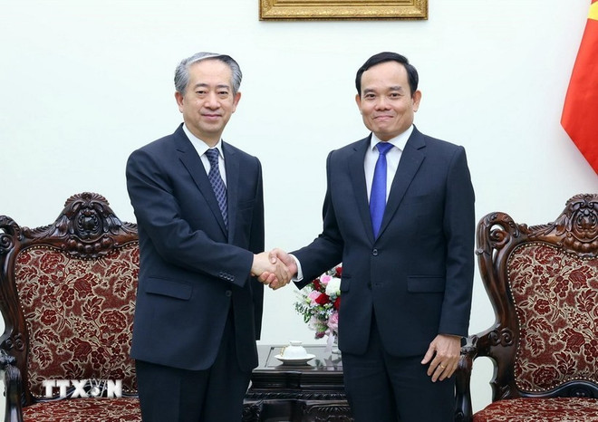 Deputy Prime Minister Tran Luu Quang (right) and Chinese Ambassador to Vietnam Xiong Bo. (Photo: VNA) Deputy PM.jpg