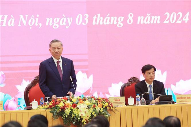 Party General Secretary and State President To Lam answers questions from domestic and international reporters. (Photo: VNA) 2 to lam.jpg