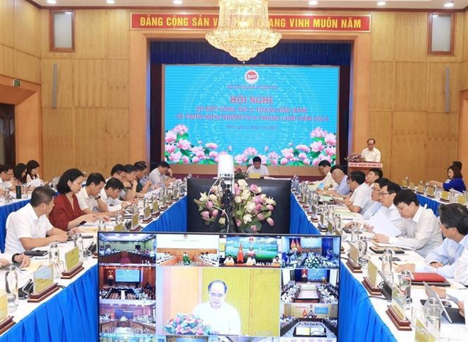 A view of the meeting. (Photo: VNA) firm2.jpg