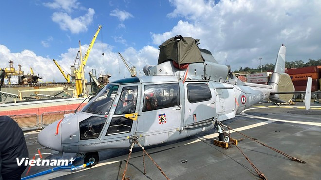 A helicopter is securely lashed at the stern of the vessel (Photo: VietnamPlus)