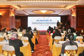 Participants at the international symposium on copyright enforcement in the digital environment in Hanoi on June 17 (Photo: toquoc.vn)