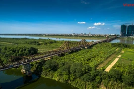 Peaceful Long Bien bridge amidst bustling capital city