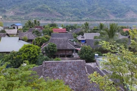 Stone-roofed stilt houses in Dien Bien province