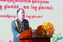 Vietnamese defence attaché Colonel Tran Van Tam speaks at the celebration in Cambodia on December 12. (Photo: VNA)