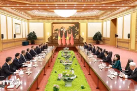 During his stay in China, PM Pham Minh Chinh meets with General Secretary of the Communist Party of China and President of China Xi Jinping in Beijing on June 26. (Photo: VNA)