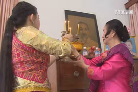 Incense keeps burning on Ho Chi Minh’s altar in Laos