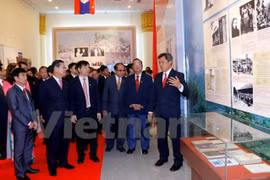 Exhibition spotlights Vietnam - Laos special solidarity 