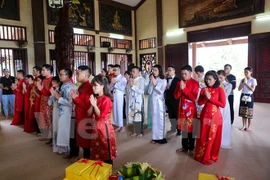 Buddhist wedding ceremony organised for 14 couples in Hanoi
