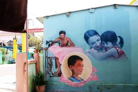 Mural brightens up Tam Thanh fishing village 